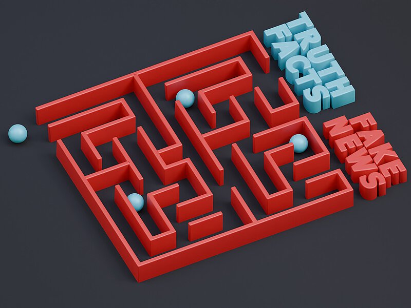 Ein Labyrinth und am Ende stehen die Begriffe "Truth Facts" udn "Fake News".